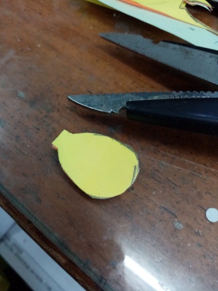 Making a Balloon Paper Clip Topper - cut out the shape through all three notes