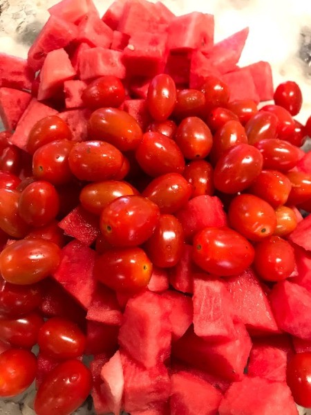 cherry tomatoes added to watermelon