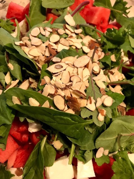 sliced almonds added to salad