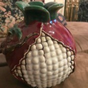 Is This a Majolica Vase? - globe shaped vase that looks a bit like a round corn cob with white kernels, purple covering from top down and around the entire back