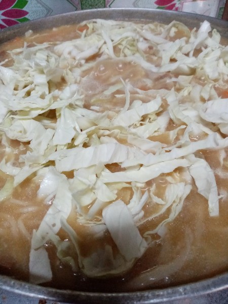 cabbage on top of Lomi