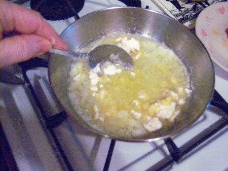 adding flour to butter