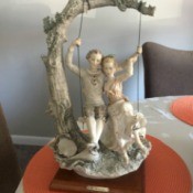 Information on a G. Armani Sculpture  - young man and woman on a tree swing