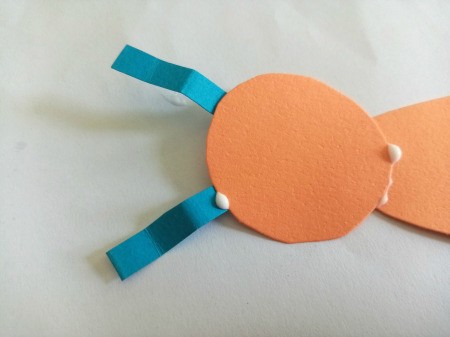 Making a Paper Butterfly Puppet - glue to the head as antennae