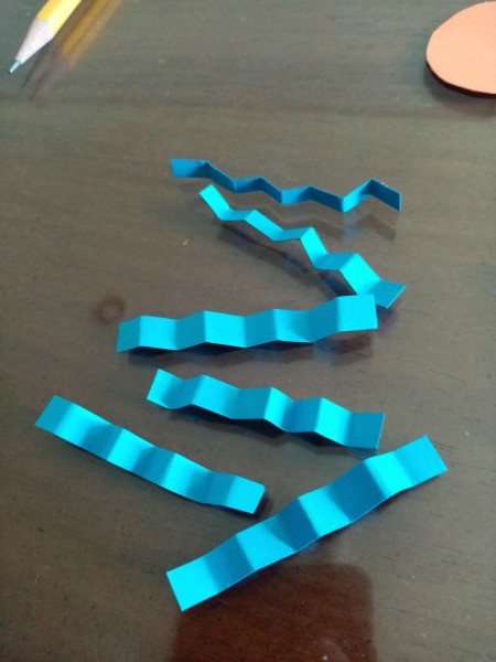 Making a Paper Butterfly Puppet - cut out 6 longer strips of paper and fold into zigzags