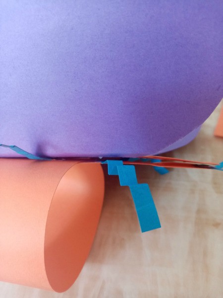 Making a Paper Butterfly Puppet - glue the winged butterfly to the first body