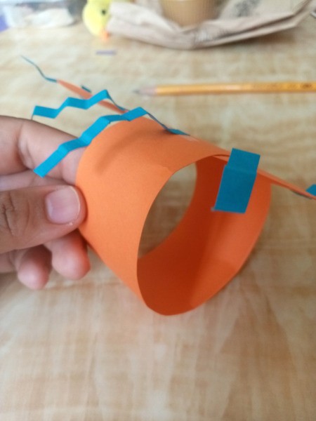 Making a Paper Butterfly Puppet - glue both ends of this strip to the first body piece