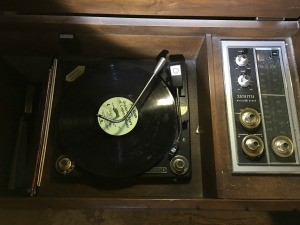 Value of a Zenith Stereo Console - open console with record on the turntable