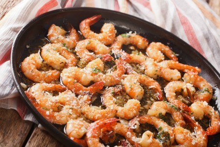 Sauteed shrimp and garlic in a pan.
