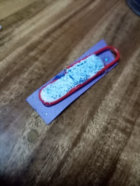 Paperclip Charm for a Zipper Pull - apply some liquid glue mixed with glitter over the hot glue