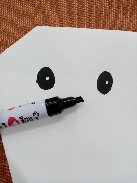 Paper Ghost Banner - draw on eyes using a marker