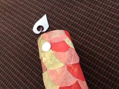 DIY Japanese Carp Streamer - cut out white circles for the eyes and glue in place near the top