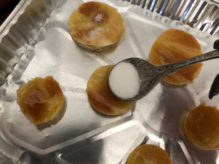 sprinkling rounds with sugar