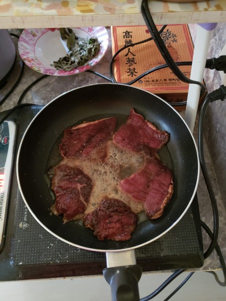 cooking beef in fry pan
