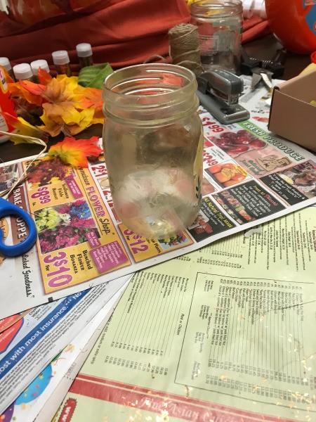 Fall Decorated Tea Light Jars - clean jar on newspaper