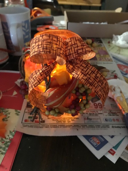 Fall Decorated Tea Light Jars - one of the jars lit up