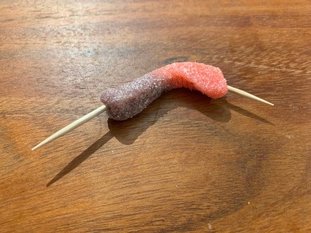 Spooky Halloween Worm Brownies - stick a half toothpick in each end of a gummy worm then stick one into one end of a second worm