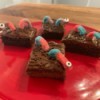 Spooky Halloween Worm Brownies - 4 worm brownies on a red plate