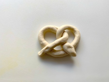 Pretzel Pumpkins - fold in half and press ends to the bottom