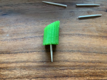 Pretzel Pumpkins - cut celery with half a toothpick pushed into one end