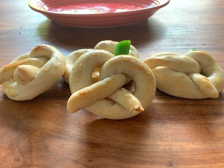 Pretzel Pumpkins - pretzels in the foregound, with a bowl of dip in the back