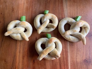 Pretzel Pumpkins - 4 finished pretzels on a tabletop