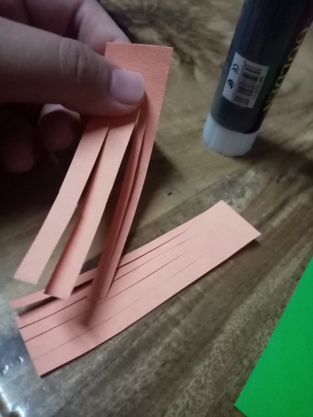 Halloween Hand Puppet - cut a 1"x3" strip of orange paper in half and make slits up the long way