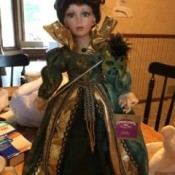 Value of a Collectible Memories Porcelain Doll - doll wearing a green ball gown