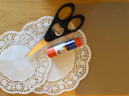 Paper doilies, scissors and glue.