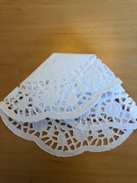 Fold triangular tip around to the back and glue in place.