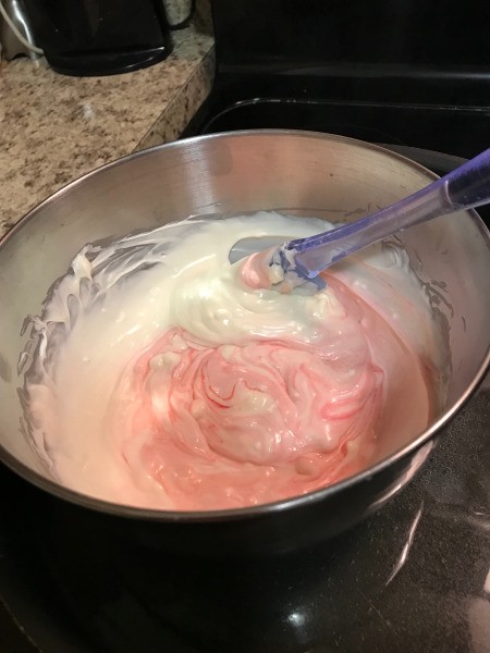 adding food color to melted chips