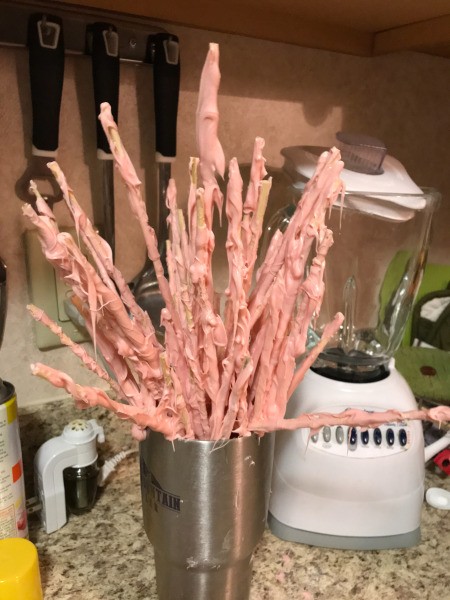 skewers coated with pink chocolate