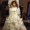 Value of a Knightsbridge Collection Porcelain Doll - doll wearing a long white dress covered in lace