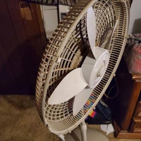 Repairing a Pedestal Fan - fan with one side open to get to blades
