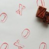 Rubber stamps with red ink.