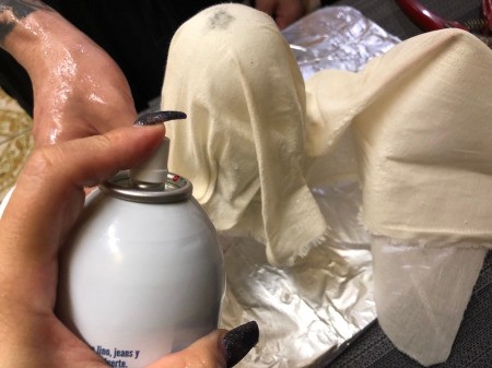 Floating Fabric Ghost - place a rectangle of fabric over the form and push down snuggly over the wire for the arms before drenching with starch