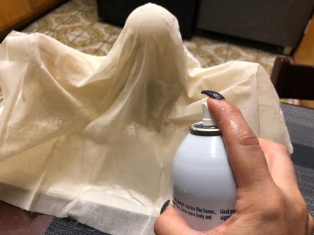 Floating Fabric Ghost - drape a large square of fabric over the form and spray with starch