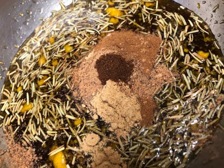 adding spices to marinade