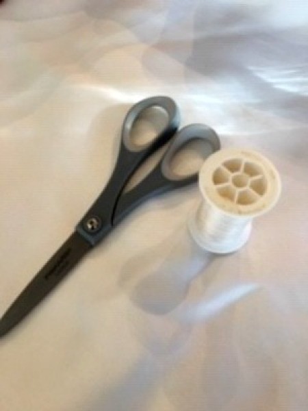 Making a Yo Yo Pillow - scissors and a spool of thread