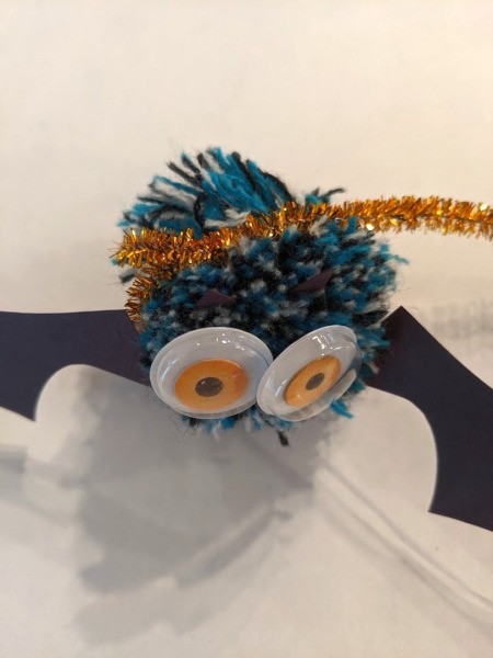 Pom Pom Bat Decoration - wrapped and attached to the hooked end