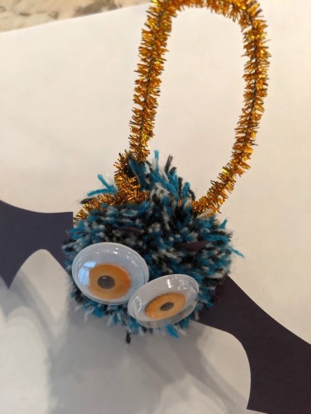 Pom Pom Bat Decoration - attached to create a hanger