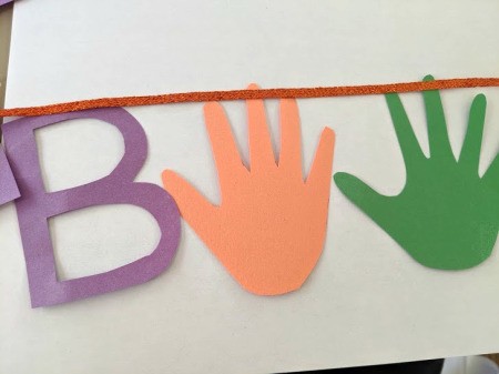 Boo Banner - attach the B and the handprints to sticker ribbon