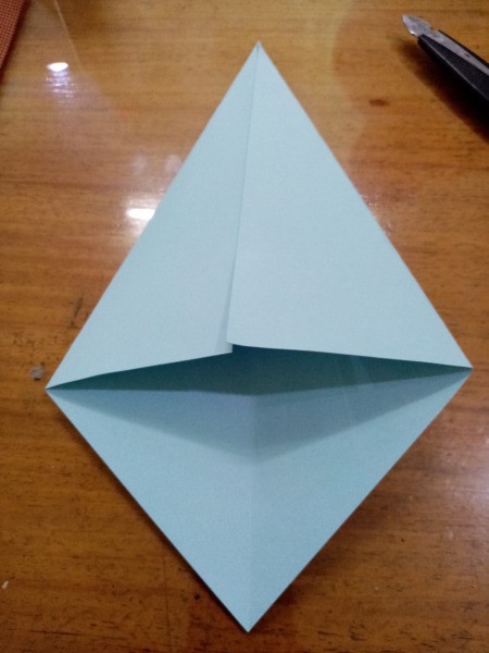 Paper Fish - open the triangle and fold the sides in to look like this