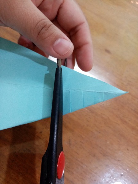 Paper Fish - fold back into a triangle and cut strips up to the center fold