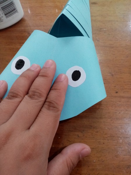 Paper Fish - lightly press the center of the head down as shown