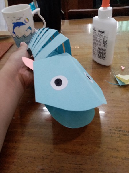 Paper Fish - curl the body as if the fish is moving