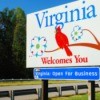 A "Virginia Welcomes You" sign on the side of a roadway.