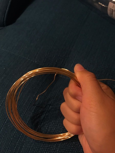 Wire Pumpkin - wrap the short end around the circle to create the center of the pumpkin