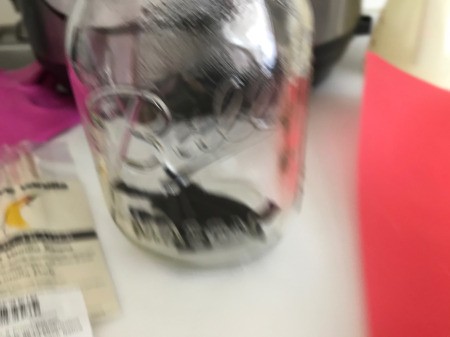 Instant Pot Vanilla Extract - empty water from the jars and add the beans