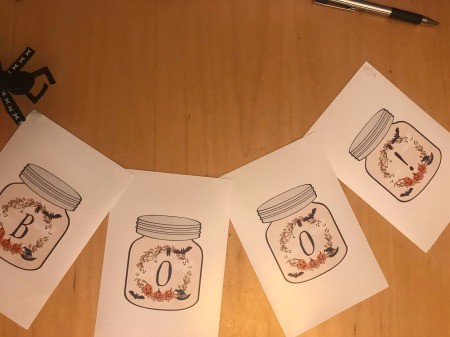 Halloween Boo! Banner Using Free Printables - apply glue dots to the ends of the banner